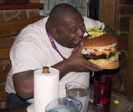 Fat guy eating burger